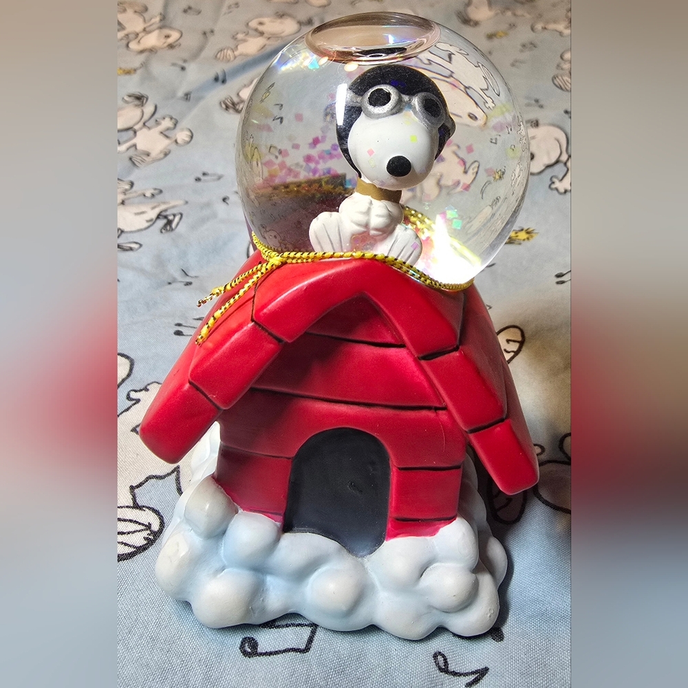Snoopy The Flying Sitting On His Famous Red Doghouse In Snow Globe